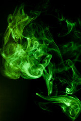 Green smoke motion on black background. - 692937879