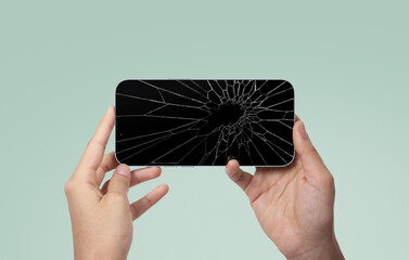 Hand Holding Broken Phone Screen Protector