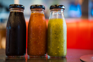 Different types of of dipping sauce yakiniku in bottles. Close up