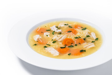 Chicken soup with vegetables isolated on white background