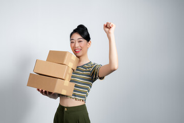 Portrait of beautiful happy woman carry boxes with orders.