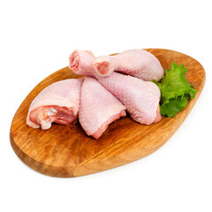 Chicken drumstick fresh on a wooden board, on a white background, isolated