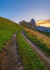 Sunrise at Seceda, Dolomites, Italy, Golden hues embrace the rugged landscape and meadows,...