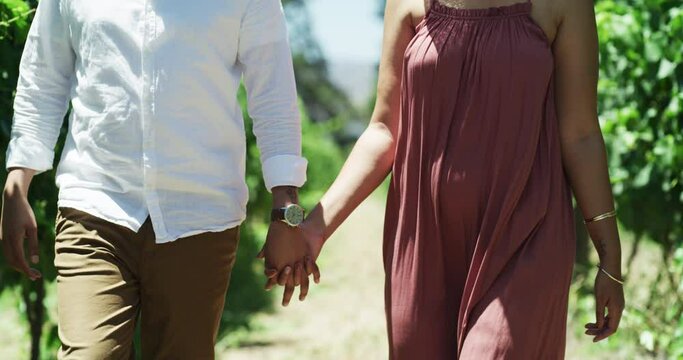 Love, couple holding hands at vineyard and walking, romantic relationship or bonding together. Man, woman and care at winery, farm or garden at countryside, holiday vacation or travel on summer date