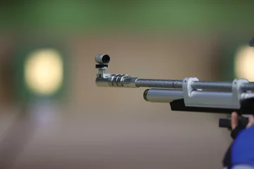 Fotobehang An air rifle in close-up. Target shooting in the shooting range. © makedonski2015