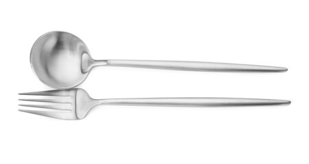 Shiny silver fork and spoon isolated on white, top view. Luxury cutlery