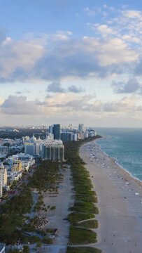 Miami Beach, Ocean and Clouds in the Morning. Aerial Hyper Lapse, Time Lapse. Drone Flies Forward. Florida, USA. Vertical Video