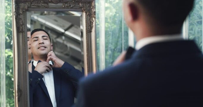 Mirror, wedding or groom with fashion, marriage or confidence for ceremony, love or celebration. Person, gentleman or happy man with a suit, bow tie or pride ready for event with smile or reflection