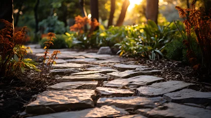 Foto op Plexiglas Path of stones in garden, Pathway in a park in autumn, Wide shot of a rustic path bordered by flowering shrubs, autumn in the forest, A solitary path in the forest with some flower  © Micro