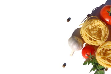 Three spaghetti in the form of a nest with vegetables lie on a white background.	