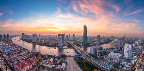 Aerial view of Bangkok city with Chao Phraya river curve during sunset