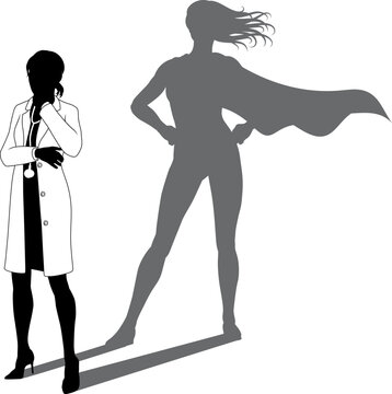 A superhero medical doctor woman health care worker revealed by her shadow silhouette as a super hero in a cape.