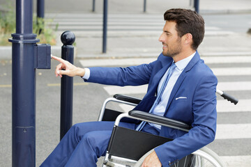 portrait of disabled businessman crossing road