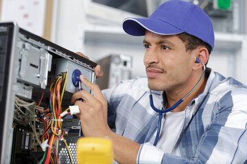 a man repairs a computer