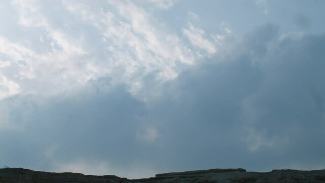 Thick clouds over rock formations under threat of demolition, Riffa, Al Janūbīyah, Bahrain.