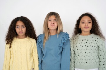 Displeased upset multi racial group of girl friends frowns face as going to cry, being discontent and unhappy as can't achieve goals,  Disappointed model has troubles - obrazy, fototapety, plakaty