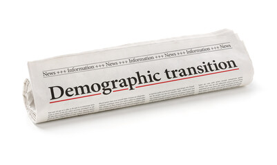 Rolled newspaper with the headline Demographic transition