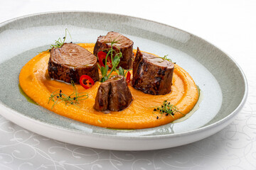 Pork loin on mashed yams. Isolated image