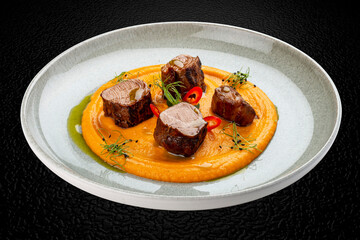 Pork loin on mashed yams. Isolated image