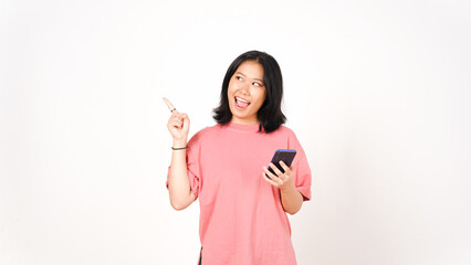 Young asian woman using mobile phone and pointing up with copy space
