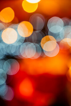 A mesmerizing Christmas bokeh background featuring a vibrant array of festive colours. The sparkling bokeh lights create a warm and magical atmosphere, perfect for holiday-themed designs.