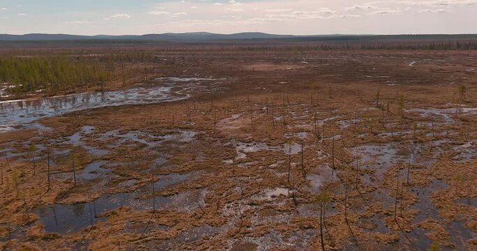 Aerial landscape view of swamp in cloudy spring weather, Sodankylä, Lapland, Finland.