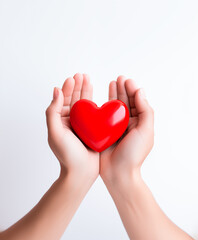 Hands cradling red heart, symbol of care and love. Valentines Day concept. Copy space.
