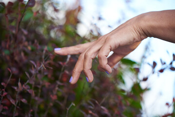 Women points a finger at plants