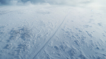 Aerial landscape of the road through snowy field