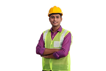 Smiling indian male architect standing in studio with arms crossed