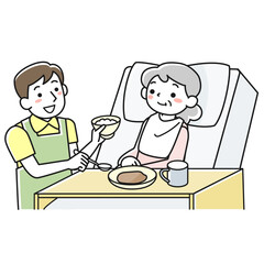 ベッドで食事をするシニア女性と介助する男性職員