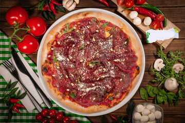 Pizza carpaccio with arugula parmesan cheese. Carpaccio on pizza