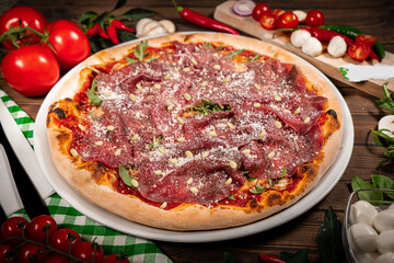 Pizza carpaccio with arugula parmesan cheese. Carpaccio on pizza