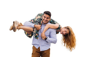 Joyful couple playing piggyback, laughing together against transparent background. Strong man lifts...