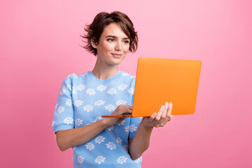 Photo of pretty nice girl hold use wireless netbook eshopping networking isolated on pink color background