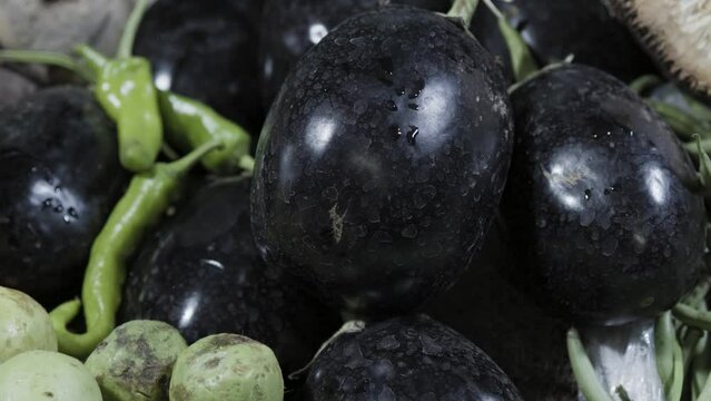 fresh brinjal at vegetable store for sale at evening