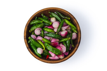 pickle of chili pepper, shallot and garlic with sour brine in a wooden bowl, isolated in white background, concept of pickle catalog, top view
