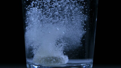 Carbonated Water with Vitamin C Tablet - Sport Medication and Wellness on black backdrop