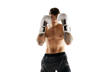 Protection. Young muscular shirtless man, boxing athlete training isolated over white background....