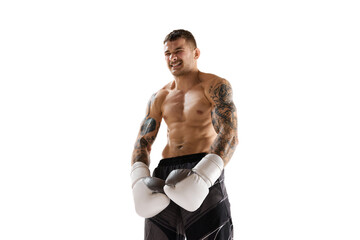 Fototapeta premium Young man with muscular strong shirtless body, boxing athlete standing isolated over white background. Concept of professional sport, combat sport, martial arts, strength