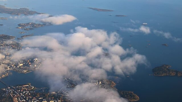 Beautiful view from the top of the city and the sea. Flying at cloud level, aerial photography