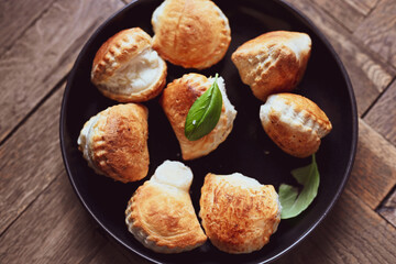 Fresh baked home made  Mini cheese puff pastries.Cheese pie with phyllo pastry and herbs