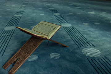 The Holy Quran on the book stand in a mosque. Islamic concept photo