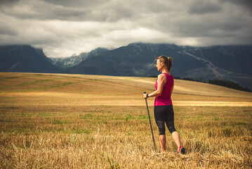 Young woman hiking in the mountains