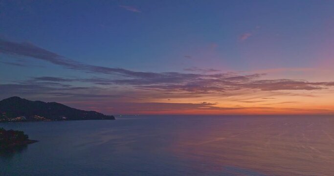 aerial view amazing colorful cloud in beautiful sky at sunset.
The sun on the horizon reflects brightly on the water surface.
Scene of Colorful romantic sky sunset with cloud in the sky background.
