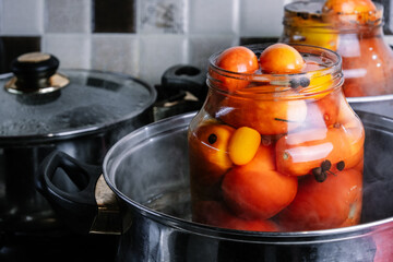 Canning tomatoes, harvesting vegetables. Tomatoes in jars.