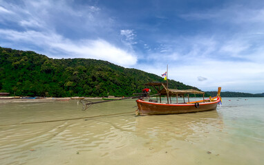 Kho Surin Island Coral reef teaming with reef fish of various colours. the Andaman Sea in  Thailand teaming beautiful lush green mountains and turquoise blue waters white sandy beaches