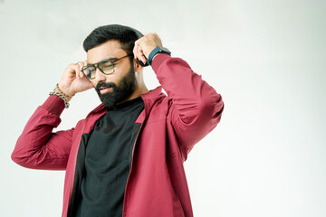 Stylish men in jackets groove to the rhythm, immersed in the music through their headphones