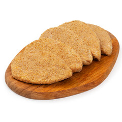 Raw chicken cutlets on a wooden board on a white background, isolated