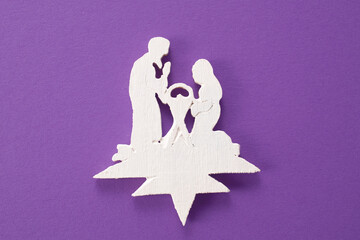 Wooden christmas creche on a wooden background